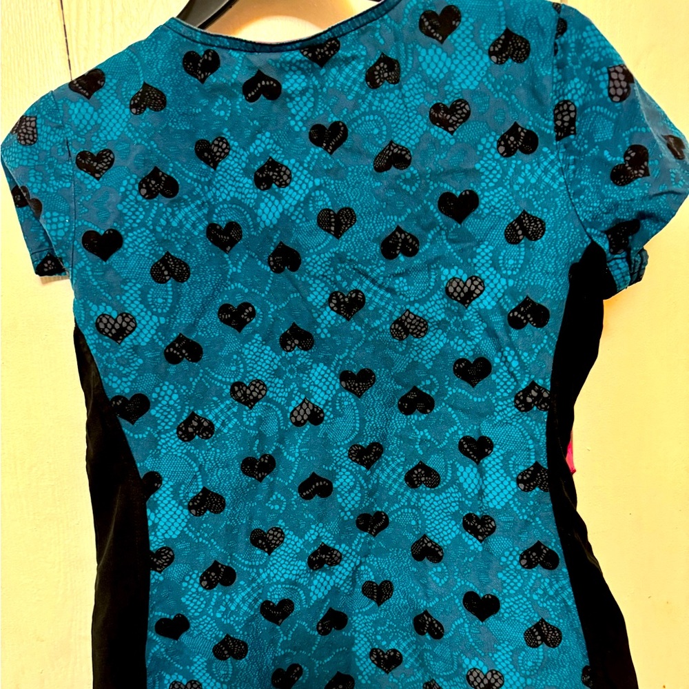 I have a gentle used scrub top blue and black